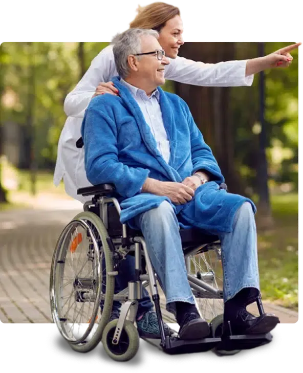 A caregiver standing behind a man using a wheelchair
